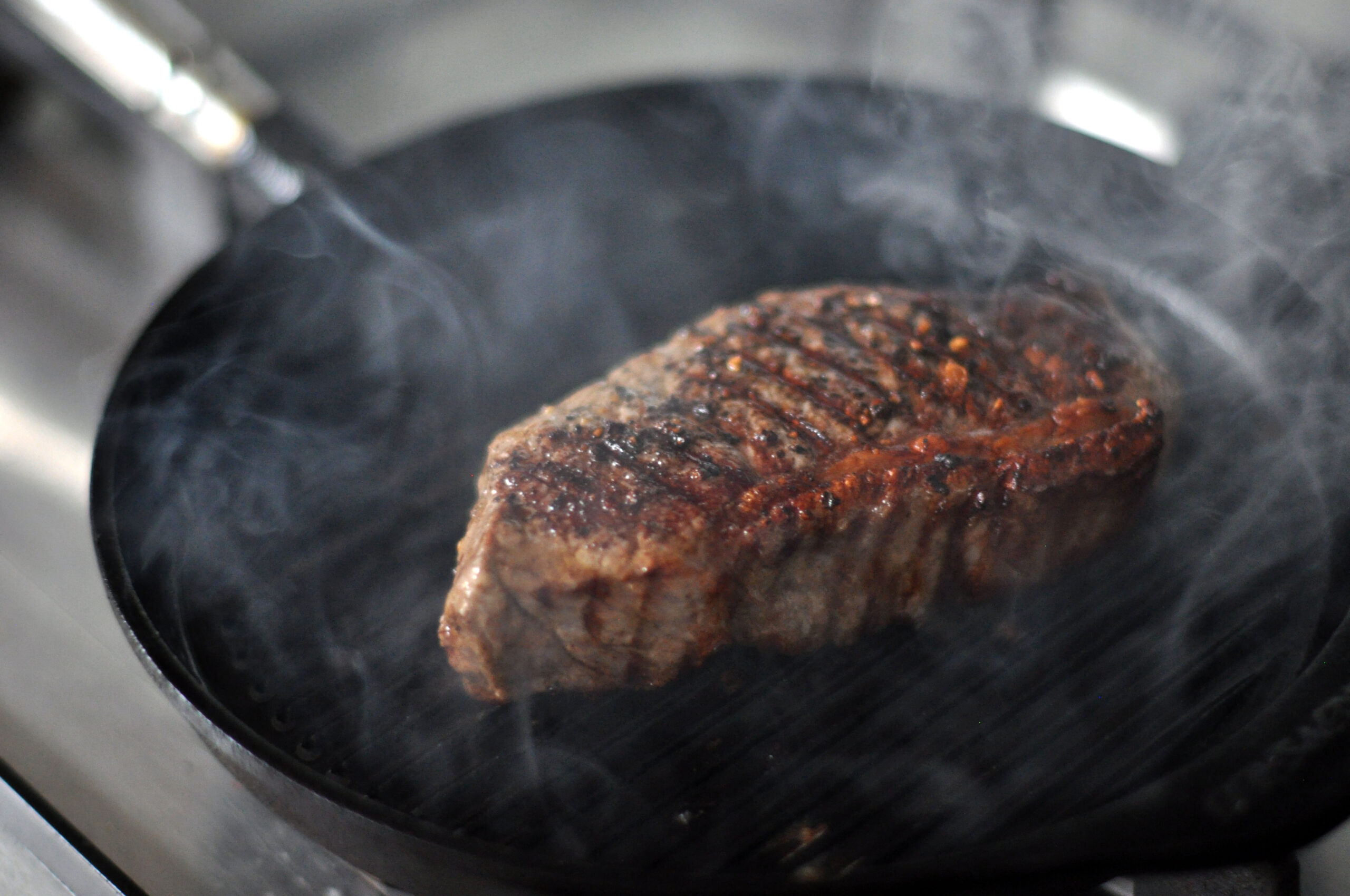 Sirloin (striploin) steak with a firm bite and a strip of fat