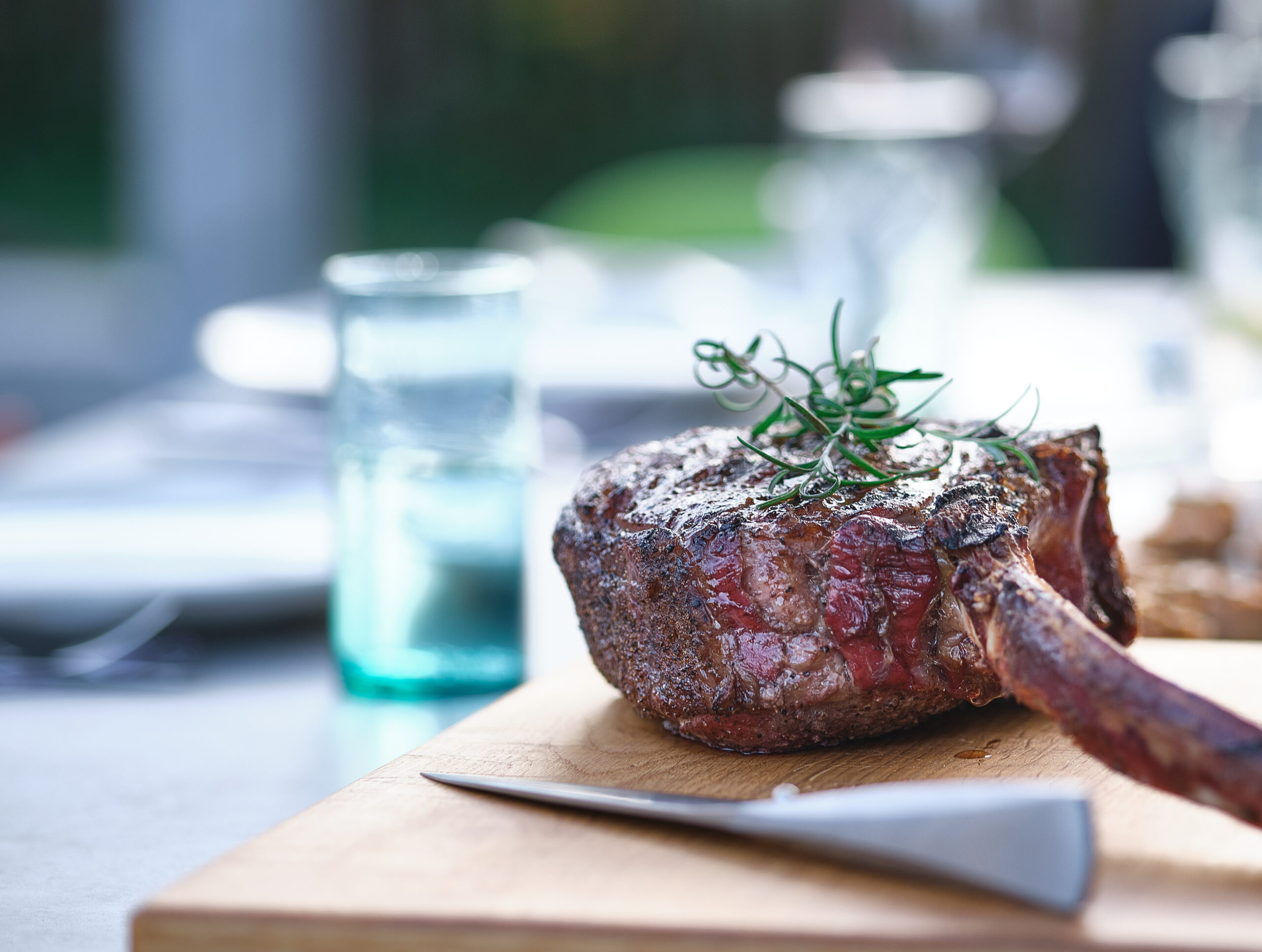 Tomahawk steak on a wooden board