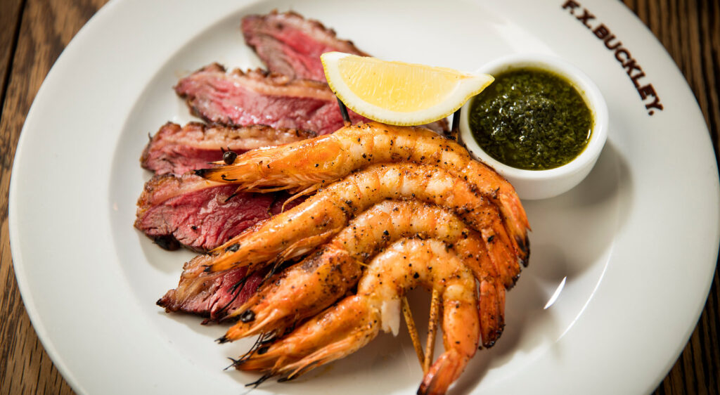 Sliced fillet steak with grilled prawns and chimichurri at F.X. Buckley Monkstown